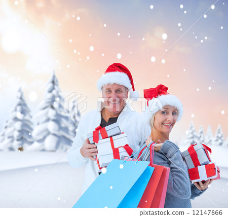 Composite image of couple with shopping bags and gifts 12147866
