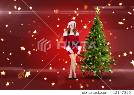 Composite image of sexy santa girl smiling at camera 12147890