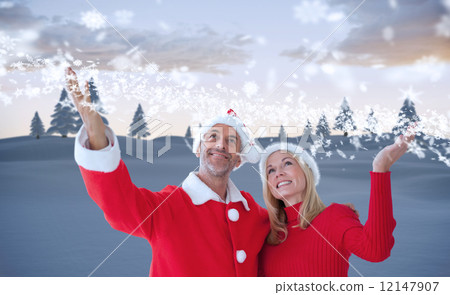 Composite image of festive couple Composite image of festive couple 12147907