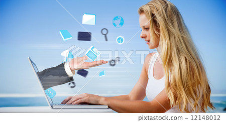 Composite image of pretty blonde using her laptop at the beach Composite image of pretty blonde using her laptop at the beach 12148012