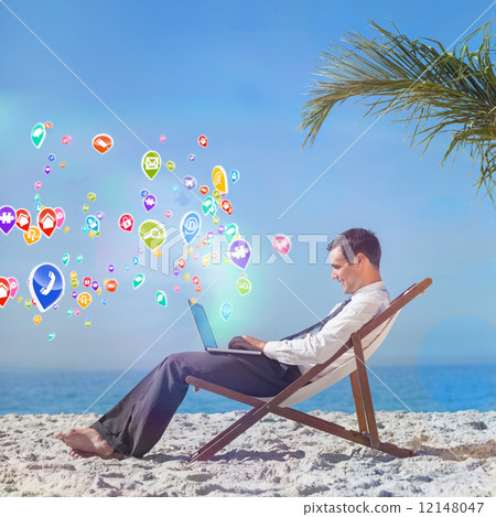 Composite image of young businessman on his beach chair using hi 12148047