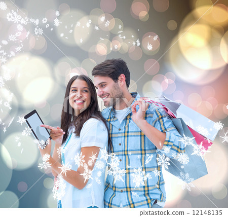 Composite image of happy couple with shopping bags Composite image of happy couple with shopping bags 12148135
