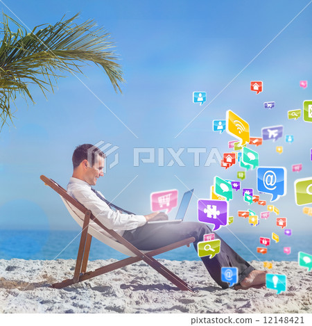 Composite image of young businessman on his beach chair using hi 12148421