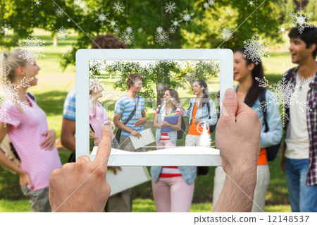 Composite image of hand holding tablet pc 12148537