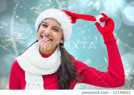 Composite image of festive brunette 12148601