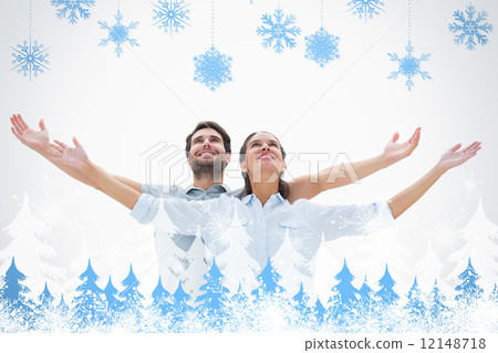 Composite image of cute couple standing with arms out 12148718