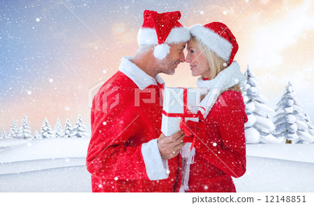 Composite image of festive couple Composite image of festive couple 12148851