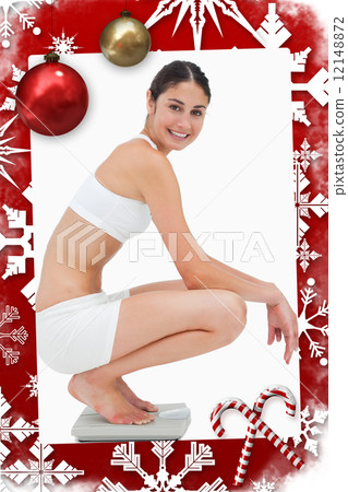 Composite image of slim young woman smiling while sitting on a s 12148872