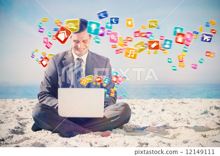 Composite image of young businessman with legs crossed typing on 12149111