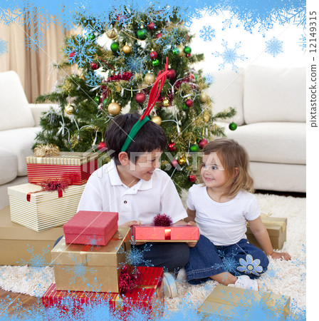 Happy brother and sister celebrating christmas 12149315