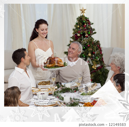 Woman showing turkey to her family for christmas Woman showing turkey to her family for christmas 12149383