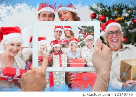 Composite image of hand holding tablet pc Composite image of hand holding tablet pc 12149779