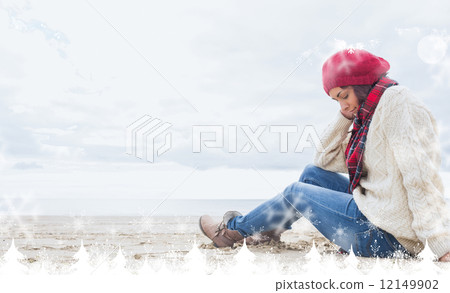 Composite image of woman in stylish warm clothing sitting at bea 12149902
