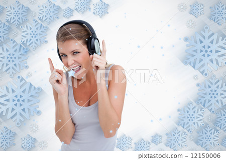 Cheerful woman dancing while listening to music Cheerful woman dancing while listening to music 12150006