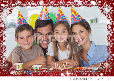 Composite image of beautiful family celebrating a party 12150042