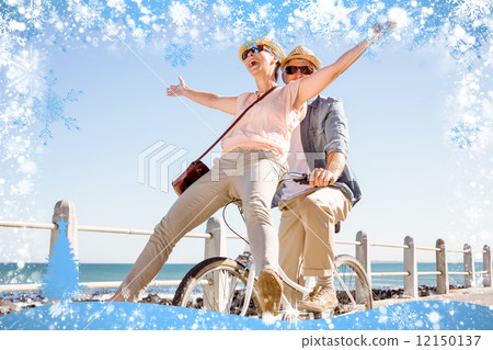 Happy casual couple going for a bike ride on the pier Happy casual couple going for a bike ride on the pier 12150137