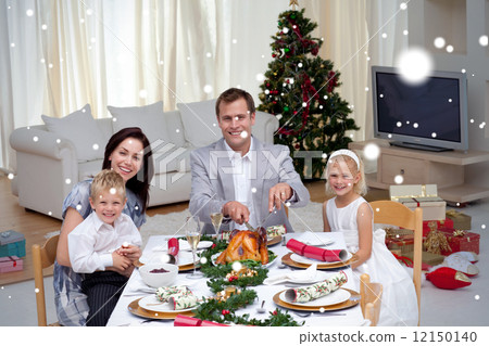 Family celebrating christmas dinner with turkey Family celebrating christmas dinner with turkey 12150140