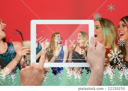 Composite image of hand holding tablet pc Composite image of hand holding tablet pc 12150250