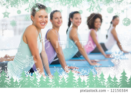 Side view portrait of a fit class doing the cobra pose 12150384