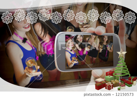 Hand holding smartphone showing photo Hand holding smartphone showing photo 12150573