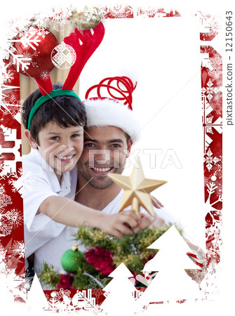 Father and son decorating christmas tree 12150643
