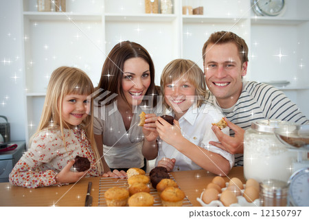 Cute children eating muffins with their parents Cute children eating muffins with their parents 12150797