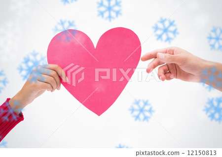 Composite image of woman passing man pink heart 12150813