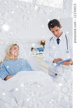 Smiling doctor showing digital tablet 12150815