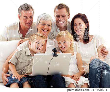 Composite image of happy family in a video conference 12150891