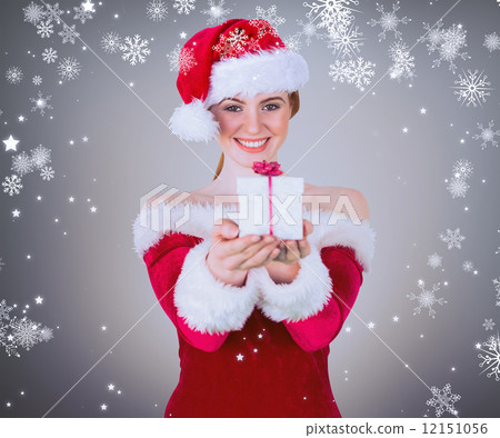 Composite image of pretty girl in santa costume holding gift box Composite image of pretty girl in santa costume holding gift box 12151056