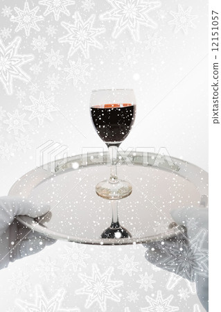 Waiter holding a glass of red wine Waiter holding a glass of red wine 12151057
