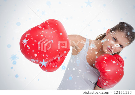 Composite image of serious woman boxing Composite image of serious woman boxing 12151153