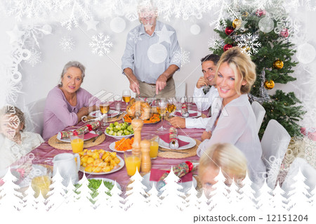 Composite image of happy family at christmas dinner Composite image of happy family at christmas dinner 12151204