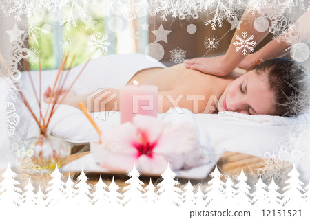 Attractive woman receiving back massage at spa center Attractive woman receiving back massage at spa center 12151521
