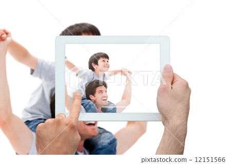 Composite image of hand holding tablet pc Composite image of hand holding tablet pc 12151566