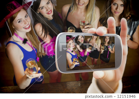 Composite image of hand holding smartphone showing 12151946