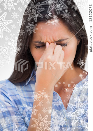 Brunette wincing with headache pain Brunette wincing with headache pain 12152078