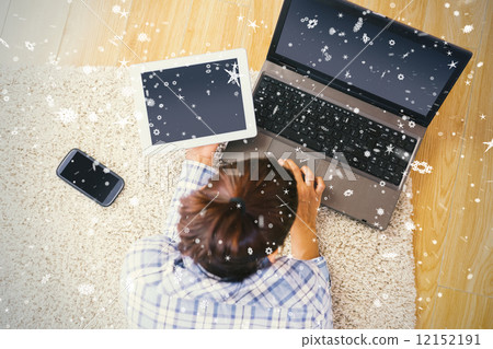 Brunette woman using her tablet and notebook Brunette woman using her tablet and notebook 12152191