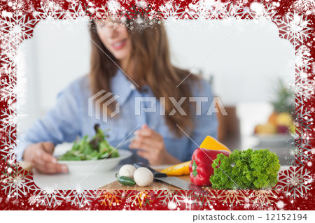 Composite image of pretty woman eating a vegetarian salad Composite image of pretty woman eating a vegetarian salad 12152194