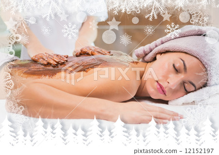 Attractive woman receiving chocolate back mask at spa center Attractive woman receiving chocolate back mask at spa center 12152197
