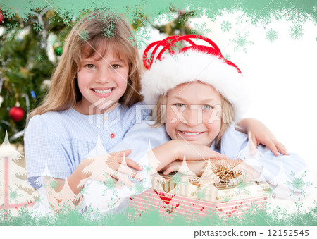 Composite image of adorable childrens celebrating christmas 12152545