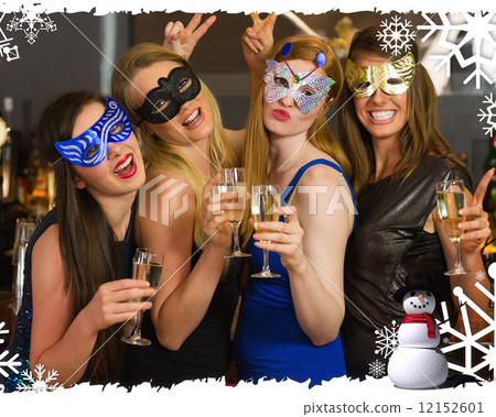 Attractive women wearing masks holding champagne Attractive women wearing masks holding champagne 12152601