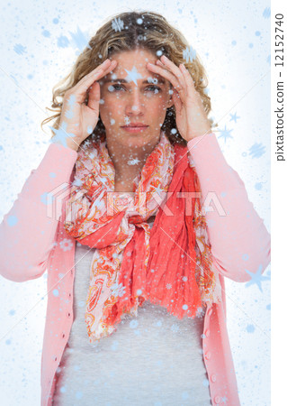 Composite image of blonde woman touching her temples because of a headache Composite image of blonde woman touching her temples because of a headache 12152740