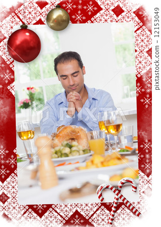 Man saying grace before dinner Man saying grace before dinner 12153049