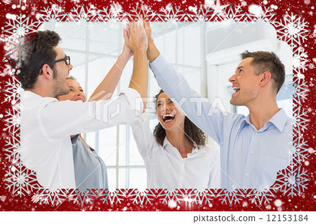Composite image of casual business team high fiving 12153184