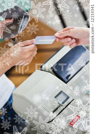 Close up of a teen woman paying with her credit card 12153341