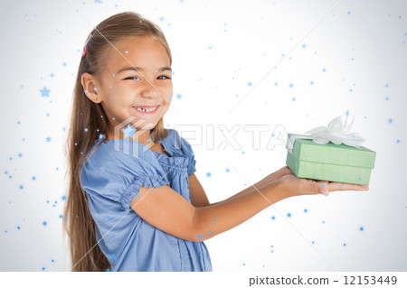 Cheerful little girl giving a present Cheerful little girl giving a present 12153449