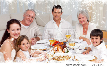 Composite image of family having a dinner together at home Composite image of family having a dinner together at home 12153450