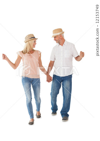 Happy couple walking holding hands Happy couple walking holding hands 12153749