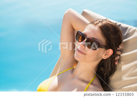 Cheerful woman by swimming pool Cheerful woman by swimming pool 12153803